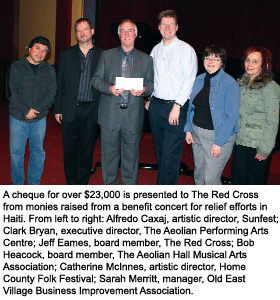 A cheque for over $23,000 is presented to The Red Cross from monies raised from a benefit concert for relief efforts in Haiti.