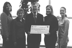 Fanshawe President and FSU President Melissa Smart proudly display the $2000 cheque along with college representatives.