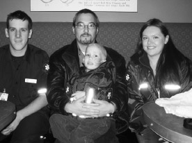 Cole poses in his one-of-a-kind jacket with his parents Jen and Brian, and Fanshawe student Josh Raikes